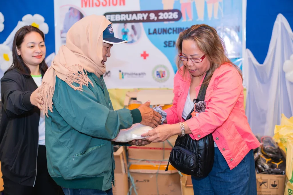 Volunteers greeting and assisting attendees